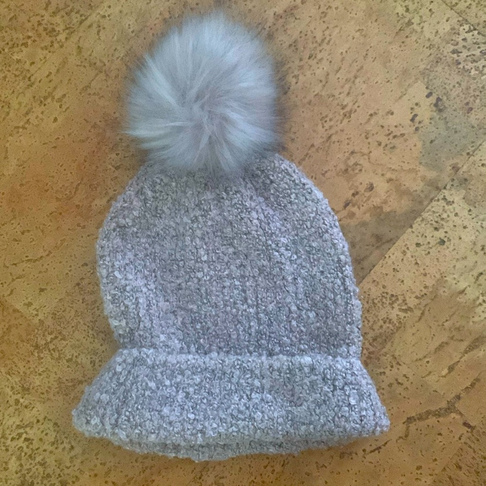 Super soft and cute knit beanie with plush puff. Dusty blush with black tipping